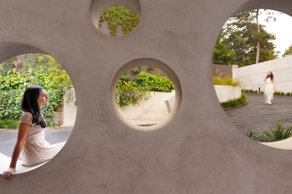 Дизайн  отеля Chinkara - сквозные круглые отверстия на стене