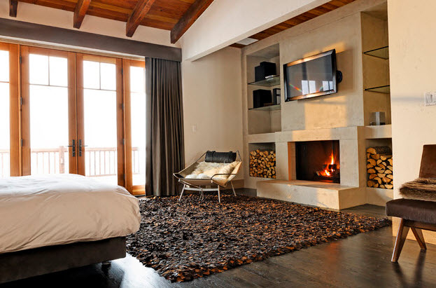 Современный дизайн спальни с камином